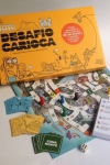 
						Desafio Carioca é um inédito jogo sobre o Rio de Janeiro, que pode ser disputado por até 6 cariocas ou apaixonados pela cidade. O tabuleiro é um descontraído mapa do Rio, onde estão retratados 20 cartões-postais, 10 praias e 6 regiões (Centro, Tijuca, Barra e Zonas Sul, Norte e Oeste).<br />
<br />
Para vencer, você precisa visitar três cartões-postais, ir a uma praia e cruzar de um ponto a outro da cidade. Mas não basta apostar na sorte. Durante todo o percurso, perguntas sobre seis temas diferentes desafiam seus conhecimentos: Recantos da Cidade; Esporte & Boa Forma; Fatos Históricos; Samba; Diversão & Arte; e Morros. Quanto mais acertar, mais você se dá bem e segue em frente.<br />
<br />
Enquanto circula pelo Rio para cumprir seu desafio, você pode ficar preso em engarrafamentos que são cada vez mais comuns. Uma solução é pegar o metrô para chegar mais rápido a algum lugar. Ou entrar num botequim, pedir um chope e relaxar!					
				 -  Jogos Familiares -  Educacional; Jogo Festivo; Empresarial; História -  Rolar e Mover; Jogo em Equipe; Jogadores com Diferentes Habilidades; Movimento de Área